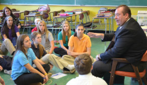 Principal at Padua Franciscan High School talking with students