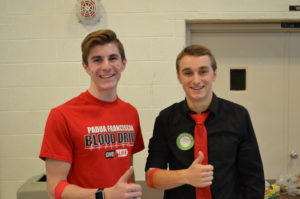 2 Padua Franciscan High School boys after donating blood at a blood drive