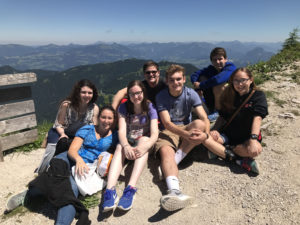 Group of Padua Franciscan High School students posing with mountains in the background